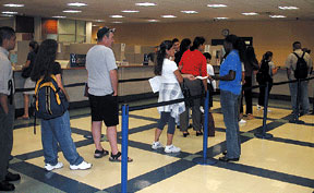 During the second weeks of school students still await their call in a long line in the Admissions and Reocrds office.
