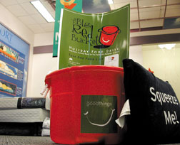 One of many Big Red Buckets set uo to hold the food donated at local malls for families in need. 