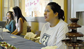 chrissy Guzman, a member of the psychology club, helps with its bake sale Tueday. The bakesale was held on Valentines Day which competed with the blood drive as well as the Valentines Day bake sale.