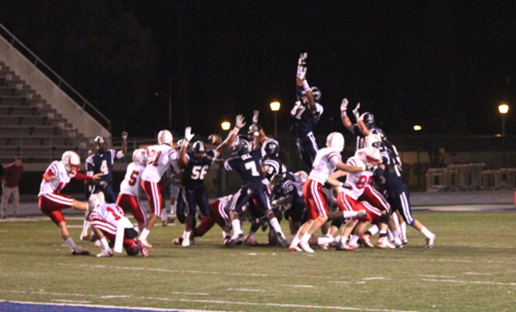 Keith McGill, No. 37, blocks the possible winning field goal. The ball was recovered and ran back