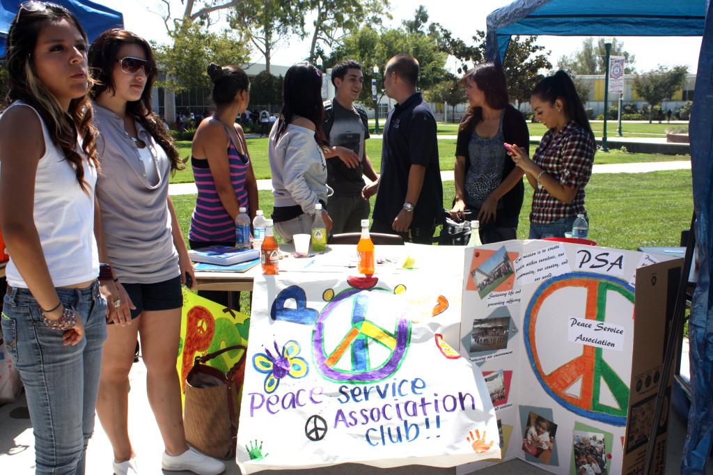 Members of the Peace Services Association club take a break from trying to attract new members. President Daniel Fragoso said they help freshman become leaders through community service, feeding the homeless and visits to childrens hospitals.