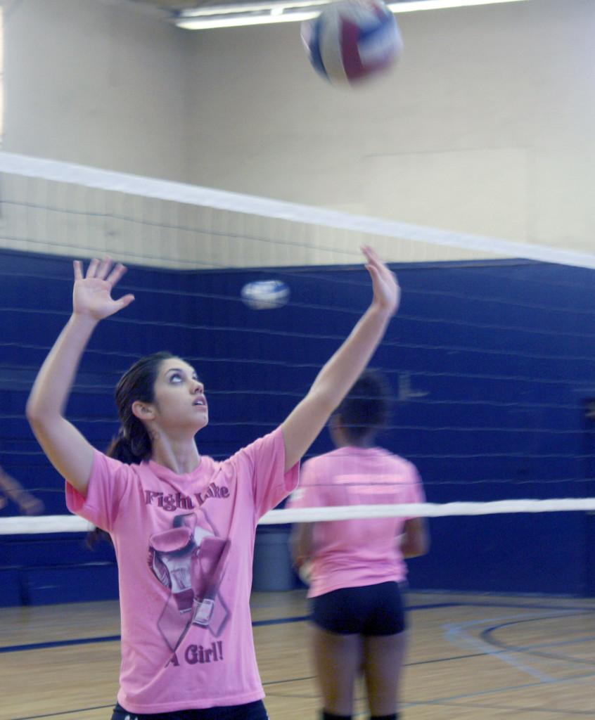 Libero Madison Guastella practices during a Falcons pre game warm up. She is also a model. 