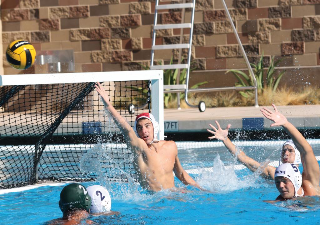 Freshman Michael Skinas saves one of Grossmont Colleges shots Saturday morning. The Falcons lost 15-5, but came back to beat Orange Coast College, 9-7, in the second game of the day.