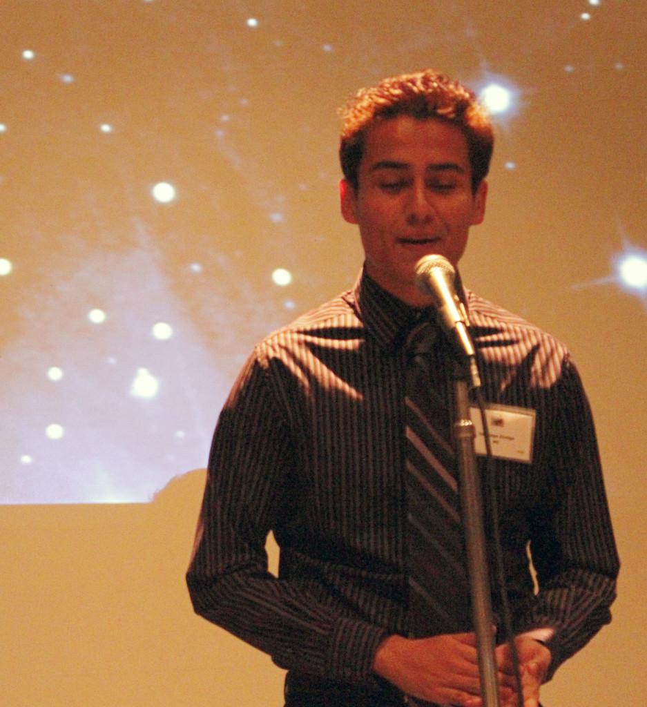Public relations major Santiago Zuniga recites a poem at the Library Club's poetry night on Nov. 30. The event gave students the opportunity to recite their poems in a competition.