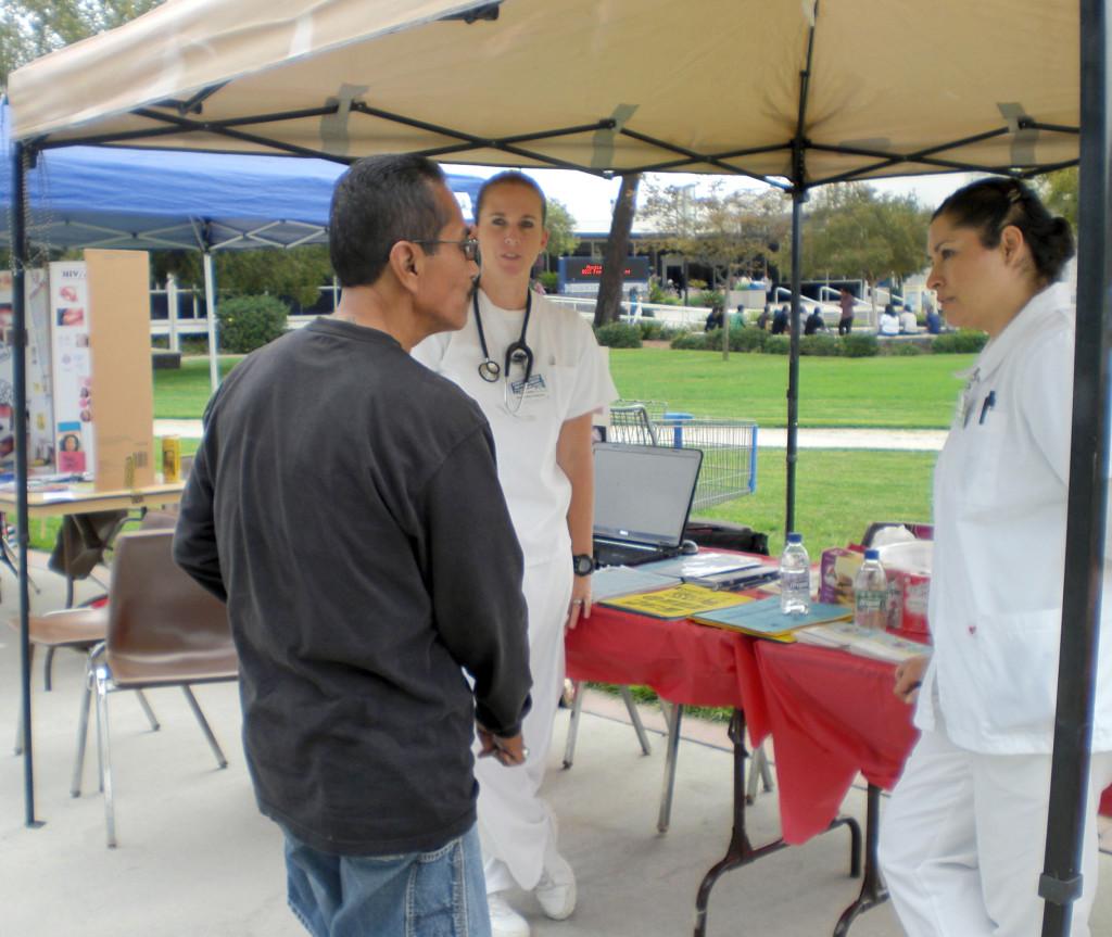  Student nurses Shelby Feldmeier and Kayla Aguilar give information to human services major Edward Aguilar.



Feldmeier and Aguilar are working at a booth in Falcon Square about Diabetes education, preventions and risk factors. 