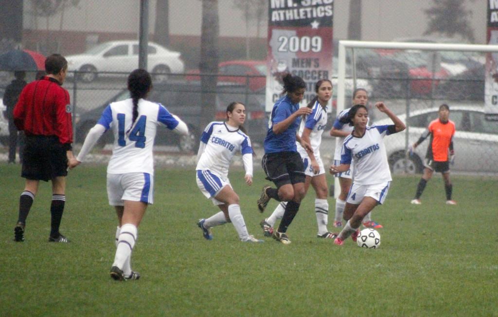 Falcon defender No. 4 Karina Sandoval positions herself against Santiago Canyon as Goalie No.1 Maria Santoyo awaits in California  Community College Soccer Championship at Mt. SAC Dec. 2. 