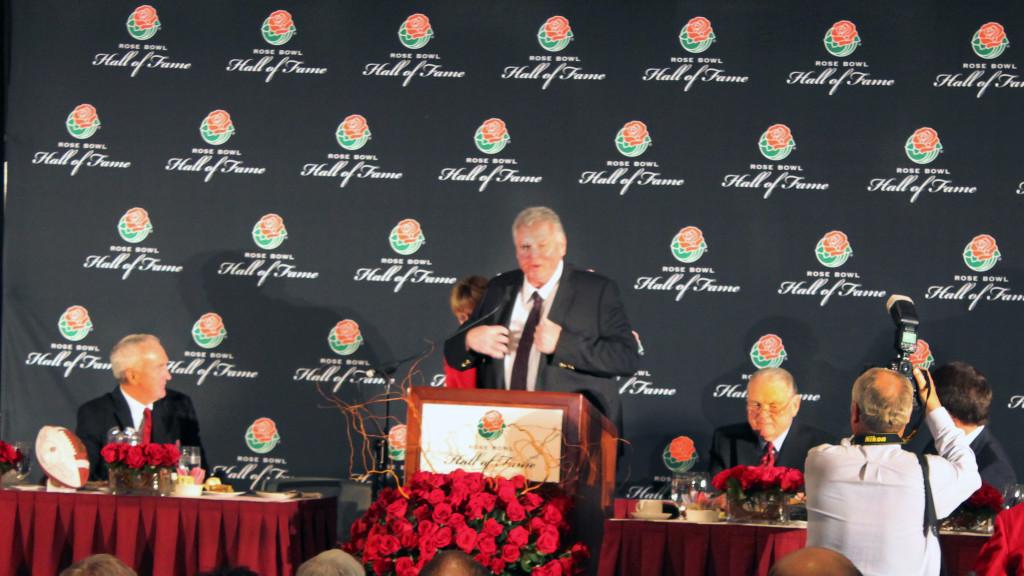 Ron Yary receiving the Rose Bowl Hall of Fame jacket from Tournament of Roses President Sally Bixby on Sunday Dec. 30 at the Pasadena Convention Center. 