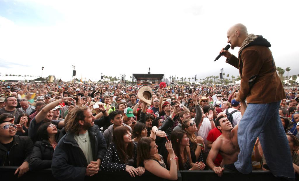 Tim Booth of James performs among fans in front of the stage at the Coachella Valley Music and Arts Festival in Indio, California, on Friday, April 13, 2012. (Brian van der Brug/Los Angeles Times/MCT)