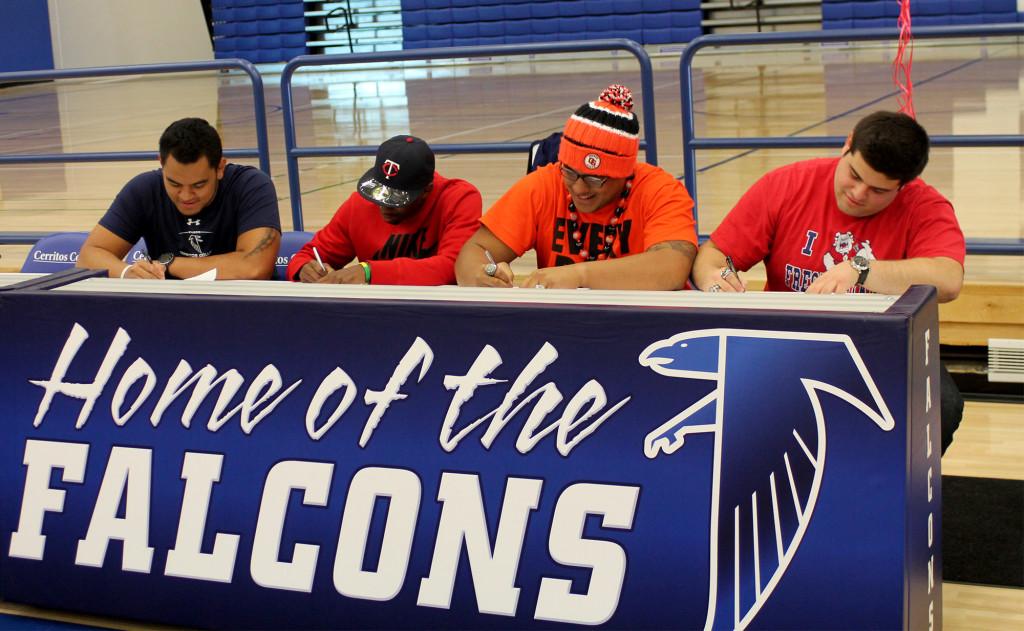 Football players sign their Letter of Intent to their four-year universities in the Falcon Gymnasium.