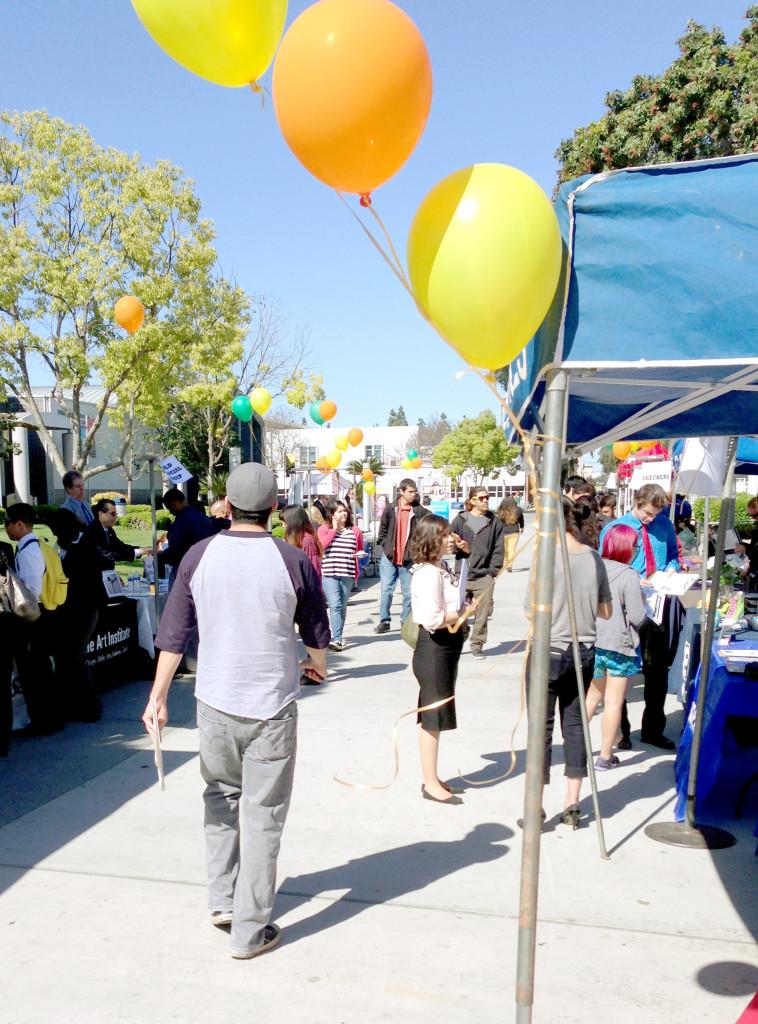 Students and recruiters gathered at the sidewalk of the Cerritos College Library. 