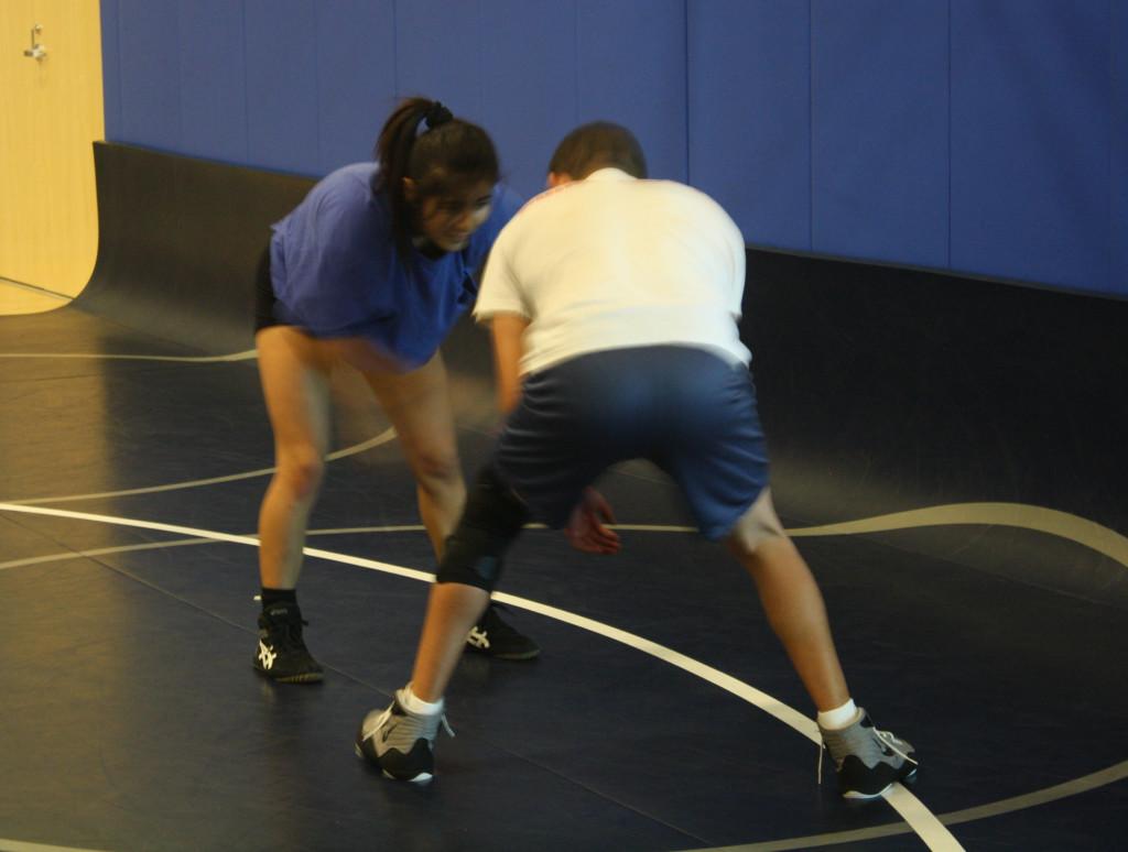 Freshman Adriana Alcaraz performing wrestling sessions during practice at the Falcon gymnasium. She previously wrestled at Downey High School and will attempt to compete this season.