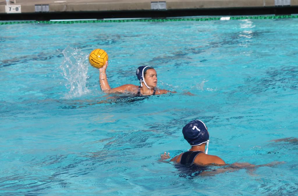 Sophomore center Catie Tuning looking to pass the ball during the womens water polos game against Long Beach City College.