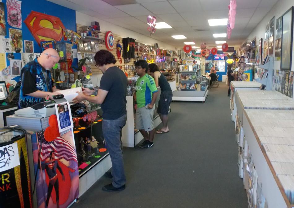 An employee of Metropolis Comics in Bellflower helps a customer. The comic book store is hosting a fundraiser on Wednesday from 5 p.m. to 8 p.m. for 11-year-old Michael Morones who attempted to commit suicide by trying to hang himself due to liking the “My Little Pony” franchise.Photo credit: Alexandra Scoville