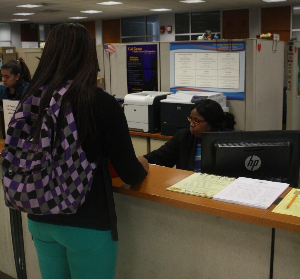 Shaquia Hughes, cosmetology major, seeking assistance from the Financial Aid Office. The Financial Aid Office is open Monday and Thursday from 8 a.m. to 4:30 p.m., and Tuesday and Wednesday from  8 a.m. to 7 p.m. 