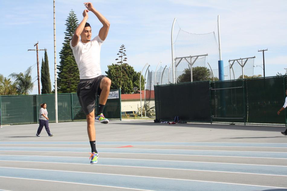 Adam Aguirre, high jumper, performing jumping drills, warming up for practice. He broke Dean Sears 1979 high jump record with a height of seven feet. Photo credit: Denny Cristales