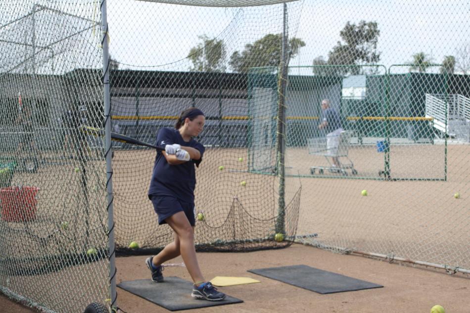 Got to love Cali: Roxanna Jensen and her father found the warm Southern Californian weather very pleasant and decided to stay at Cerritos College. Jensen practices her batting as coach Murray focuses on strong batting.