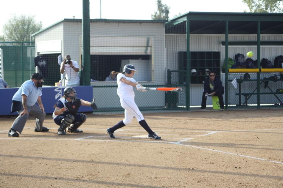 Falcons outfielder Roxanna Jensen connects on her three run home run on March 4 against Harbor. Photo credit: Mario Jimenez