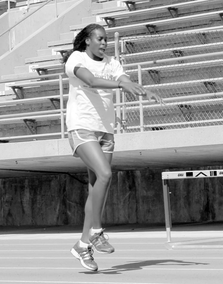 Alexus Dalton warms up on the track before practice. Photo credit: Luis Guzman