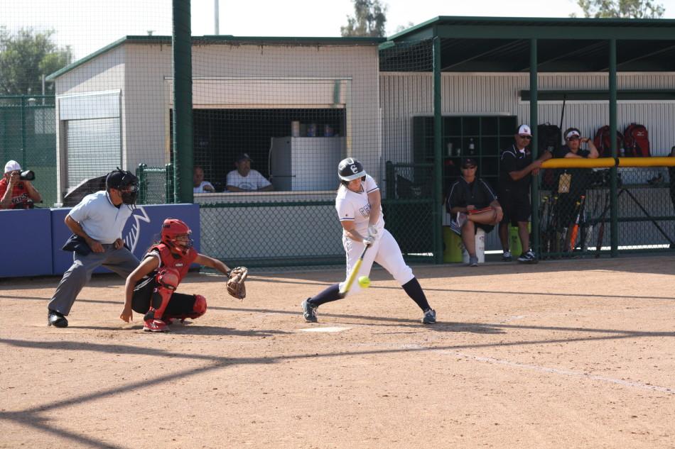 Falcons first basemen Haley Whitney smacks an RBI single into left center against the Vikings on April 8. Cerritos would go on to blowout LBCC 10-0. Photo credit: Mario Jimenez