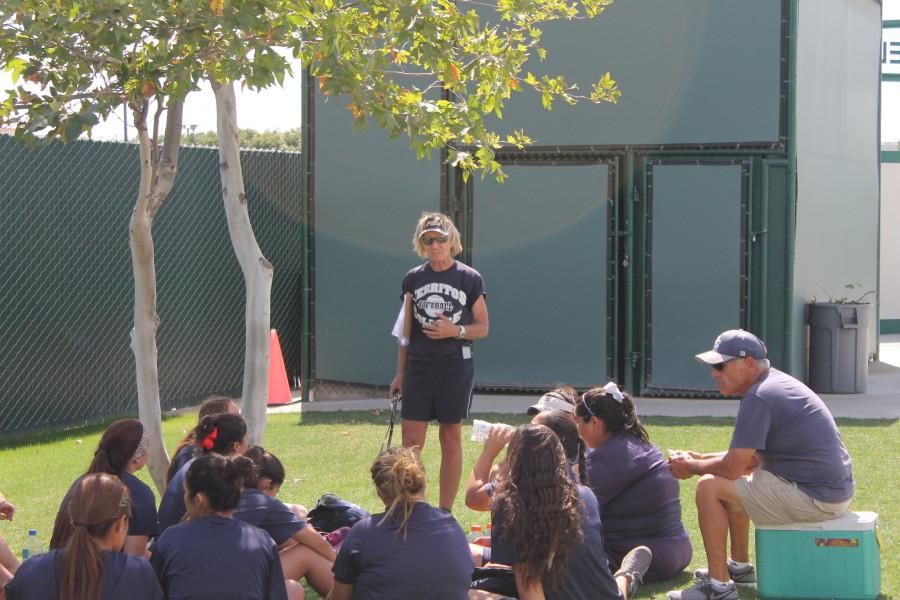 Head softball coach Kodee Murray having a meeting with her players after practice on May 1. 