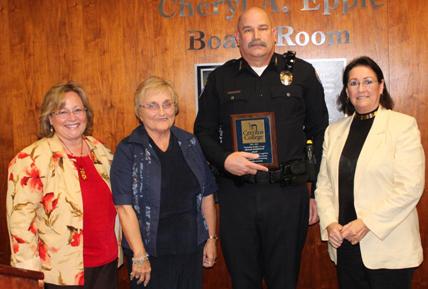 Lucinda Aborn, Marilyn Brock, and Rachel Mason  presenting Police Chief Bukowiecki the award for Outstanding Classified Manager of the Year in 2012.