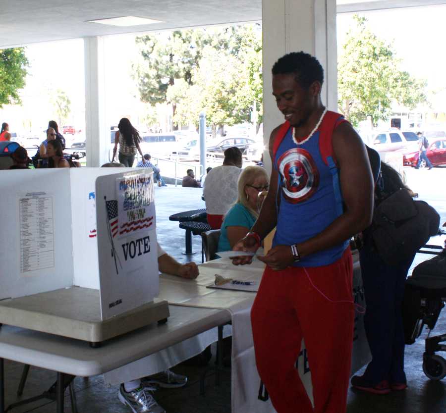 Tyrece Britton, a kinesiology major, participating in the voting polls. Photo credit: Daniel Green