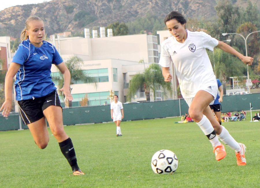 Forward Nayeli Requejo drives the ball against a Santiago Canyon defender in the CCCAA State Champioship game. Requejo would win the Most Valuable Player award.