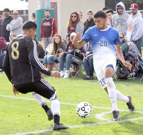 Defender Christian Hernandez maneuvers away from Mt. SAC midfielder Juan Ortega in the CCCAA State Championship game. 