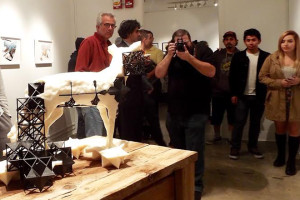 Students, faculty, and community members gathered around artist Jeff Cain's 3D-printed sculpture, scanned from an actual taxidermy coyote that can be seen in the Cerritos College art gallery.
