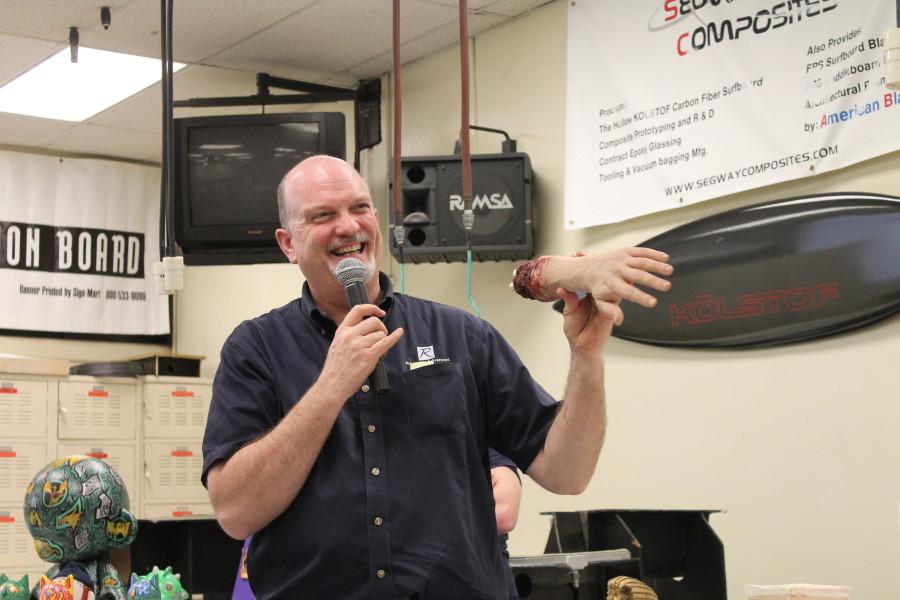 Guest speaker explains to those attending the open house that molding and casting has its many uses, like this severed arm for medical and Hollywood gag purposes. Photo credit: Sebastian Echeverry