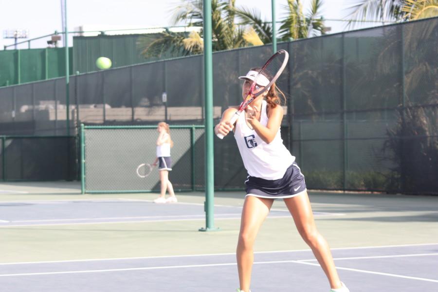 Stef+Flores+backhands+a+volley+in+her+singles+match.+Photo+credit%3A+Christian+Gonzales