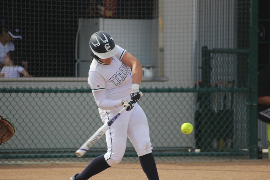 Cerritos catcher Krystal Purkey connects for a grand slam in the first inning. She hit another home run in the fourth for a 16-6 Falcons victory. Photo credit: Monica Gallardo