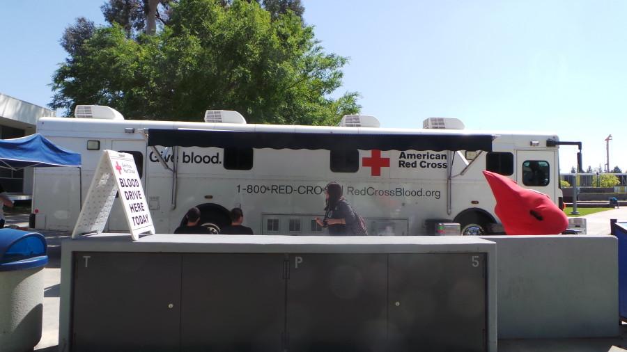 The American Red Cross donor bus in Falcon Square on April 13. The bus holds five beds so that five donations are collected at a time. Photo credit: Perla Lara