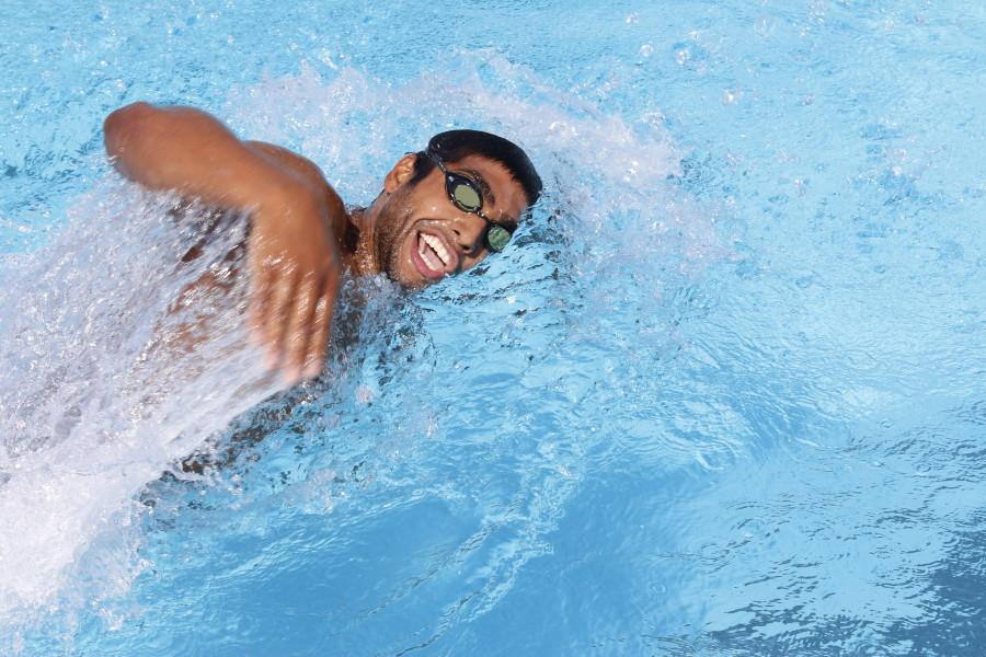 Backstroke swimmer Marlon Moreno  freestyles during swim practice. Photo credit: Emily Curiel