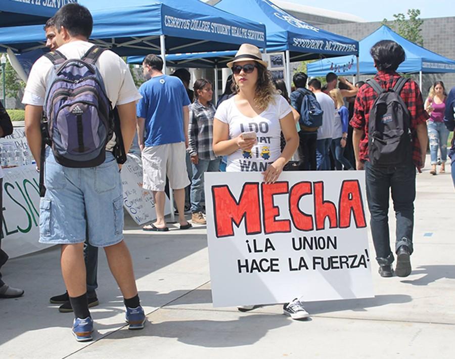 Viridiana Cabrera, Nursing major, provides students with information on why they should join MEChA on club day. MEChA enforces student empowerment on campus.