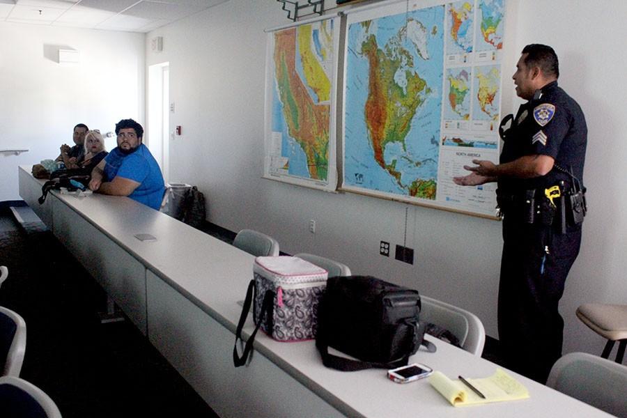 Enrique Rueda, Crystal Barraza, and Hugh Rueda (from left to right) listen to Sgt. Angel Castillo (right) response to Crystal Barraza question. Her question was “Does talking to my mother on the phone while walking to my car at night is a good idea?”