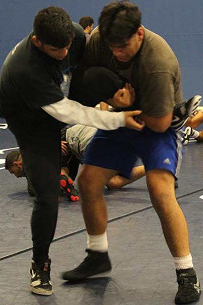 Left Oscar Martinez and right Jesse Gomez. The team practicing their moves on each other before the Wednesday Oct. 21 match. Photo credit: Toni Reveles