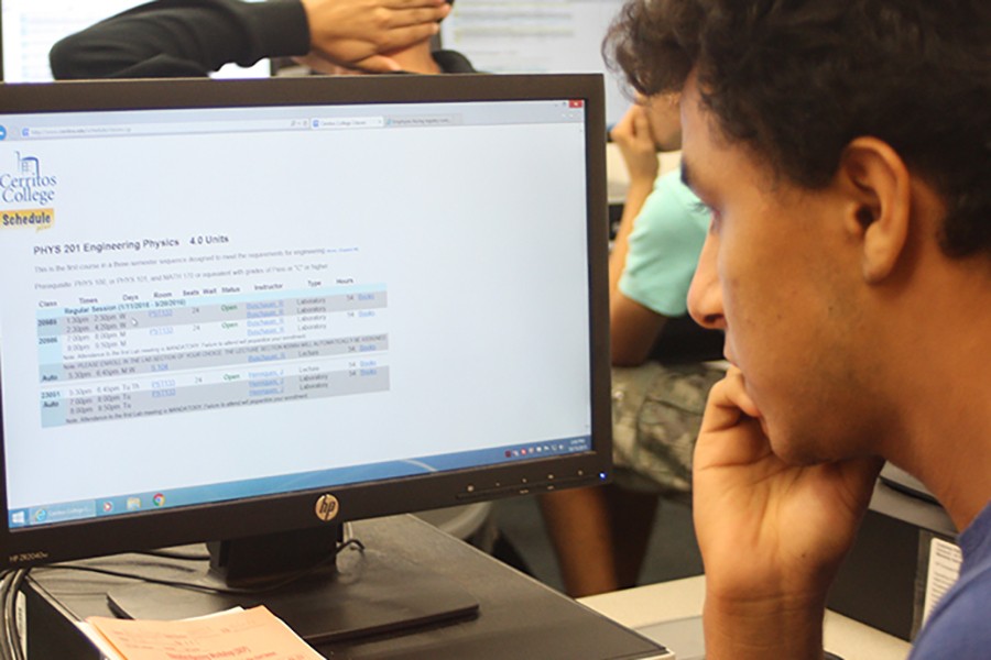 On Thursday, Oct. 15, K16 bridge program held a workshop for freshman, so that they can learn how to enlist for classes. Adrian Rodriguez, freshman and math major, was one of the sudents in attendance. He is looking for what classes to take next semester. Photo credit: Grester Celis-Acosta