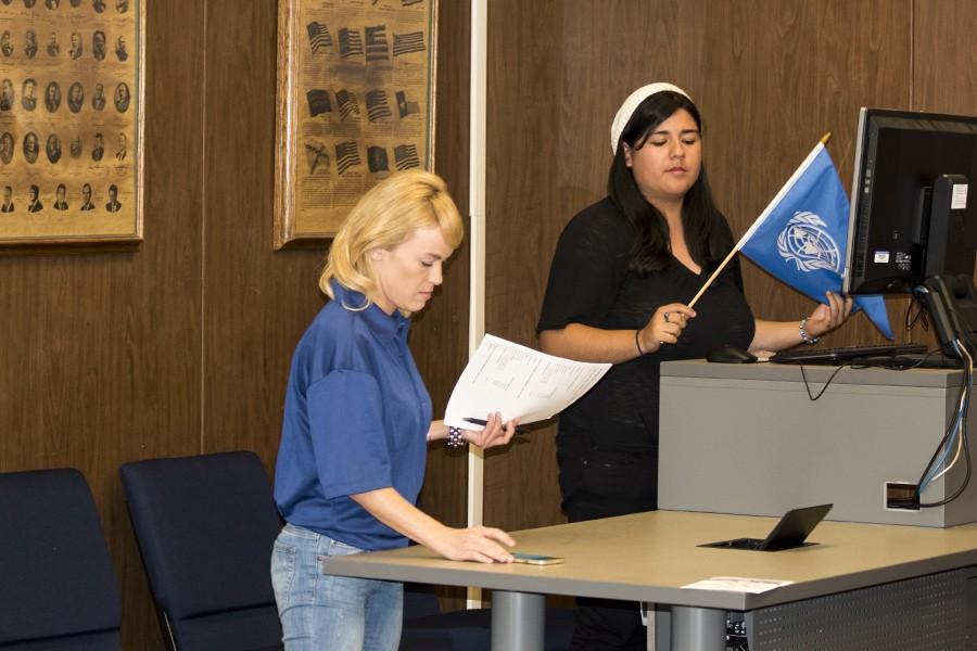 Model UN Director of Public and External Affairs Jessica Germata (front) and Model UN Secretary-General of Training and Recruitment Bianca Salgado (back) preparing for their presentation at the Wednesday Sept. 30 ASCC senate meeting. Salgado managed the powerpoint presentation while Germata gave details on the conferences that will be attended by the club.