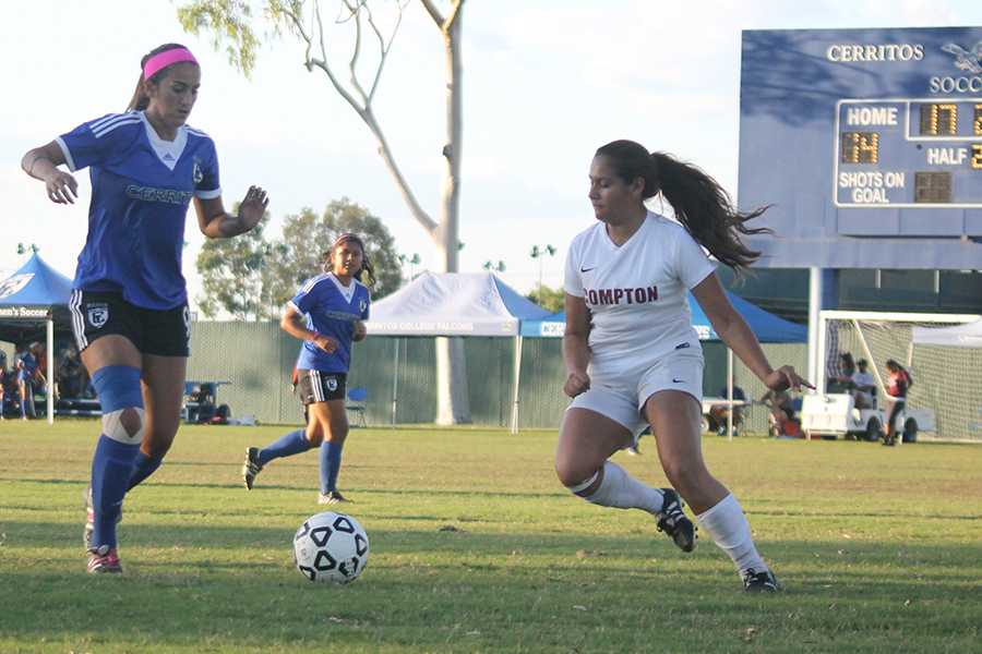 Forward, Natalie deLeon, attempts to get past a Compton-Center defender,
deLeon scored 3 goals and made 3 assists. The Falcons broke two records in the course of the game.