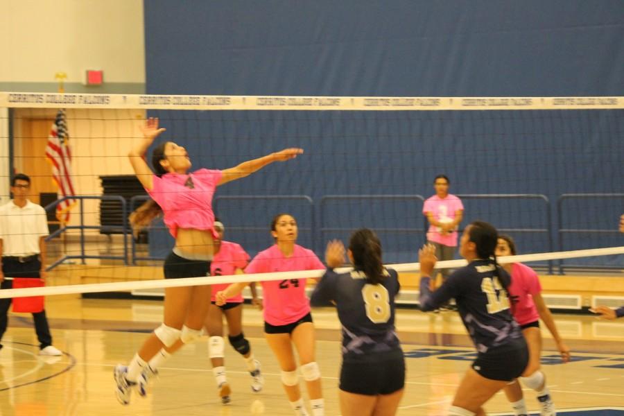 Nicole Spigner No. 4 goes up in attempt to spike the ball down over the heads of Los Angeles Harbors Monique Rios No.8 and Kaitlynn Young No. 12. Spigner once again led the Falcons in kills with nine. Photo credit: Taylor Ogata