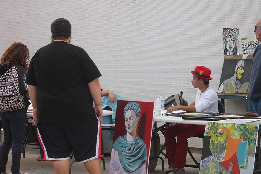 The Cerritos College Arts Club set up an art sale where members feature personal works of art. The club’s goal is to generate funds for future events to showcase the club members’ talent