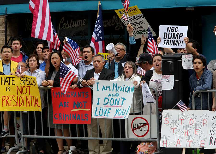 Approximately 100 protesters rally outside the City Club of Chicago before the arrival of 2016 presidential candidate Donald Trump on Monday, June 29, 2015 in Chicago.  (Antonio Perez/Chicago Tribune/TNS)