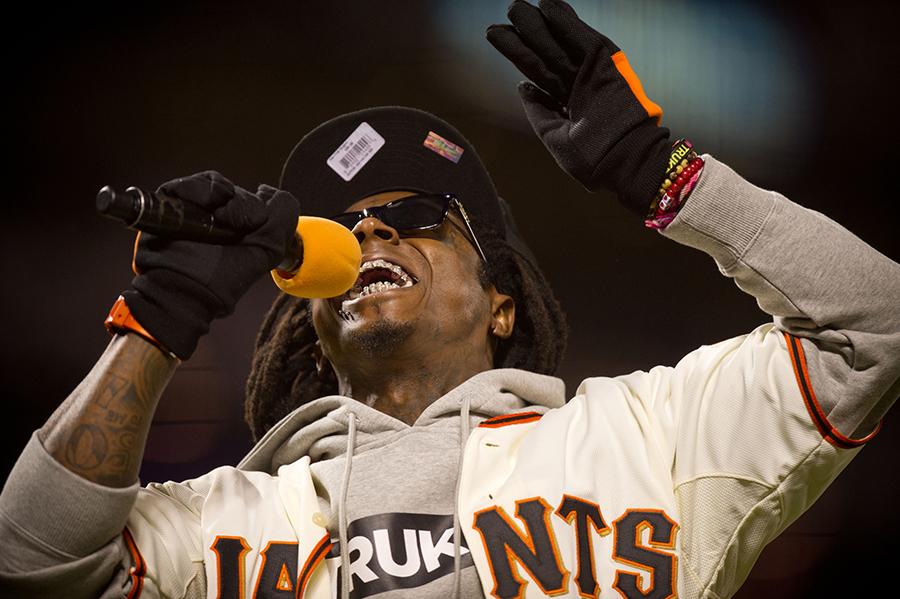Rapper Lil Wayne performs "Take me out to the Ballgame" during Game 6 of the National League Championship Series at AT&T Park on Sunday, October 21, 2012 in San Francisco, California. The Giants won, 6-1. (Jose Luis Villegas/Sacramento Bee/MCT)