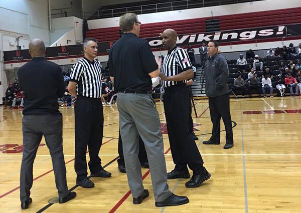 Discussions are long before play resumes. Referees are trying to maintain order.