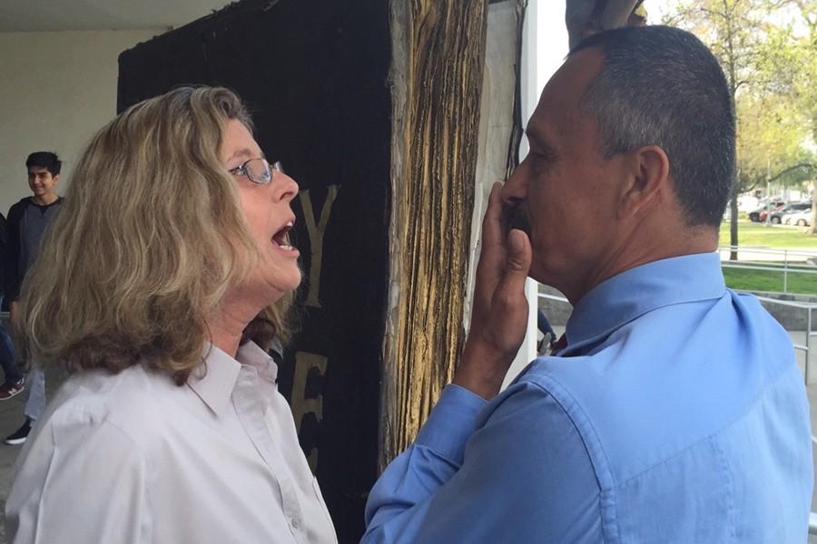 Pirtle and Mendoza argue face to face as the crowd of people stood by to watch. The evangelist preachers showed up on campus to “give a fair warning to the students of Cerritos College.”