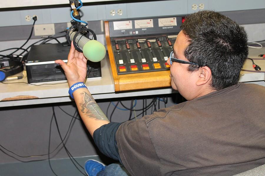 Rob Flores working in the studio at WPMD. His show was deemed the best Student Public Affairs Radio Program in America by The Intercollegiate Broadcasting System. Photo credit: Janel Oliver