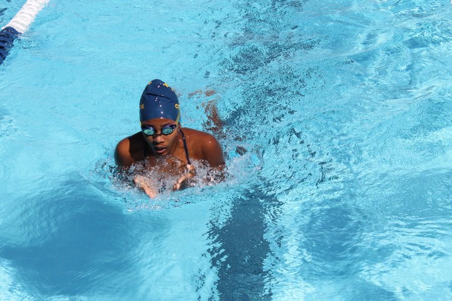 Freshman Channon Owens gasps for a quick breath during the womens 200-yard IM. Owens competed in two events on the day. Photo credit: Terrel Emerson
