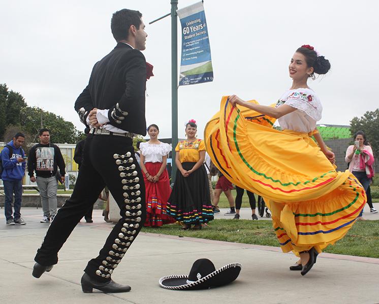 Juliet Martinez and Gilberto Quezada, MEChA club members perform a tradtional cultural folklore dance for the audience. With the help of ASCC, MEChA was able to help bring light to a dominant culture on campus. Photo credit: Kristopher Carrasco