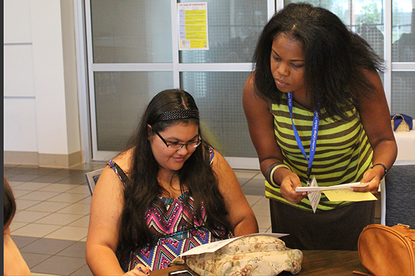 Carla Yorke (Dual Management Manager) helping Bridge student Angelica Valenzuela find her classes on campus. The event was held at Cerritos College on Wednesday Aug 10. Photo credit: Benjamin Garcia